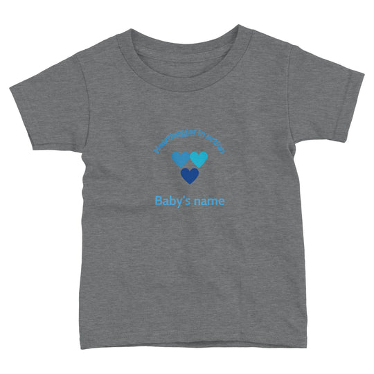 Toddler t-shirt with 'Hearthugger in Action' design, customizable with name on front, 'Loved by all' on the back." Sizing Chart: "Size chart for a toddler t-shirt with measurements in inches and centimeters 5b4c10c3-86ad-4b66-811d-55cbd703c83e