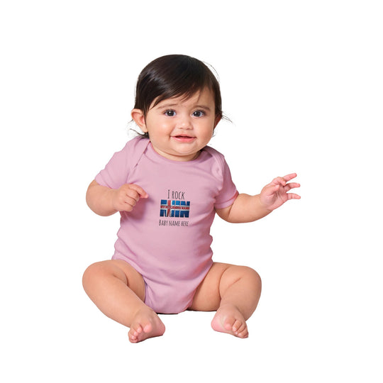 Custom baby onesie with I Rock slogan and Icelandic name in Pink 9a220aaf-815e-49fe-8388-4b90014221e2