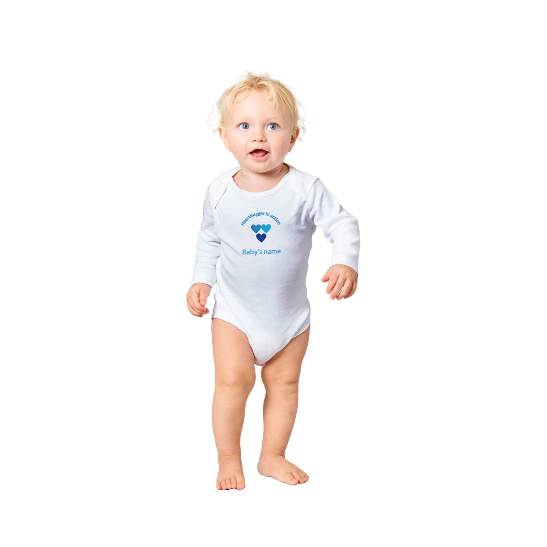 cd3056dd-f2d9-4b57-af71-d46b7a36a509 Classic white baby bodysuit with three blue heart's design, customizable with baby's name on front and 'Loved by all' message on back.