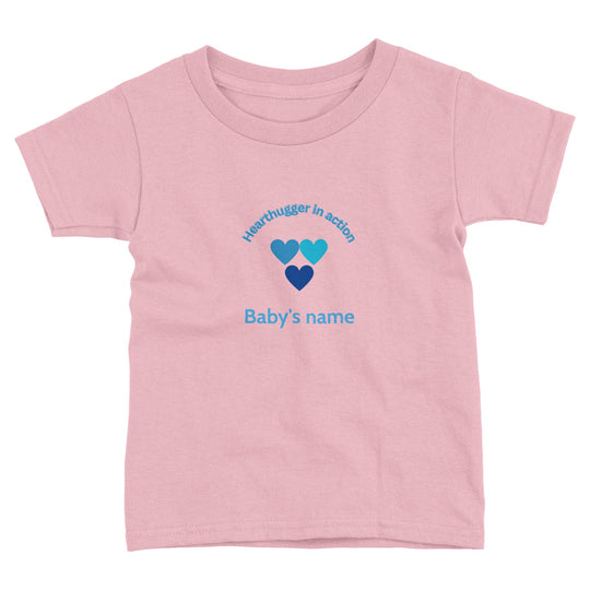Toddler t-shirt with 'Hearthugger in Action' design, customizable with name on front, 'Loved by all' on the back." Sizing Chart: "Size chart for a toddler t-shirt with measurements in inches and centimeters d5b84215-d092-40fd-b943-158af42c79c1